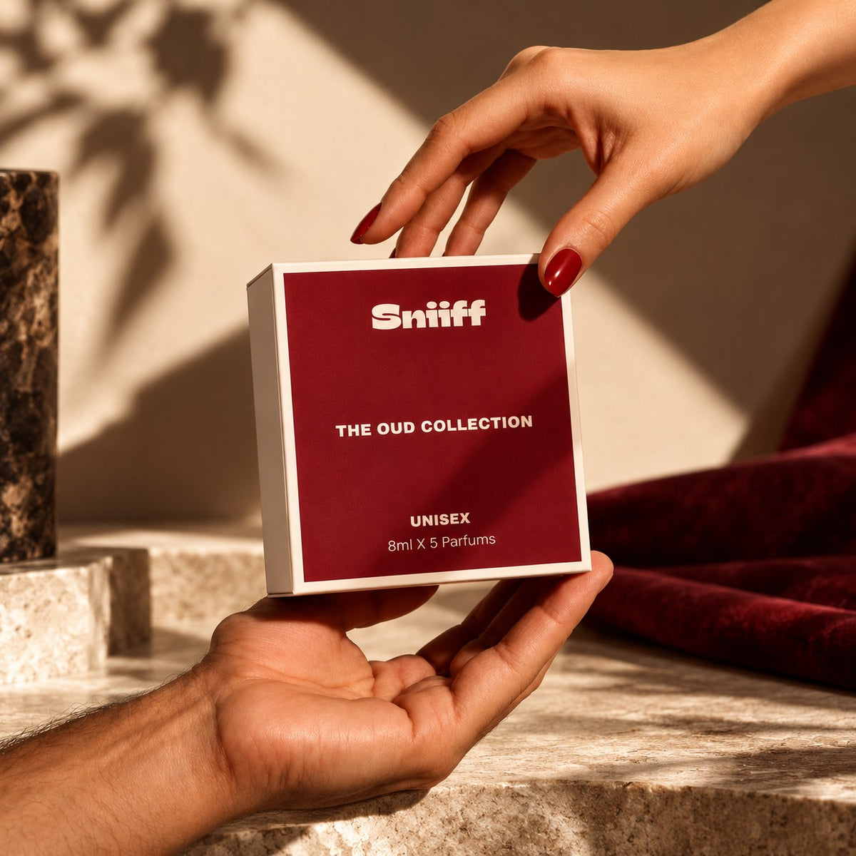 Sniiff The Oud Collection – box held in warm sunlight