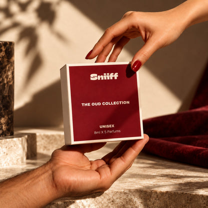 Sniiff The Oud Collection – box held in warm sunlight
